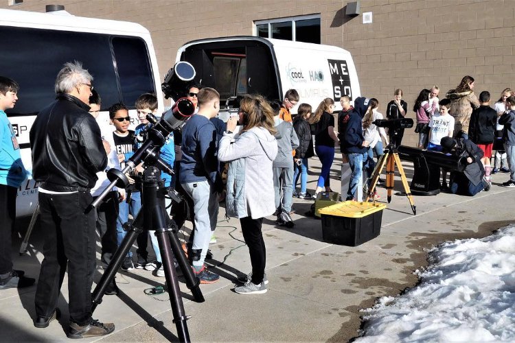 MESO at an outdoor science festival with telescopes