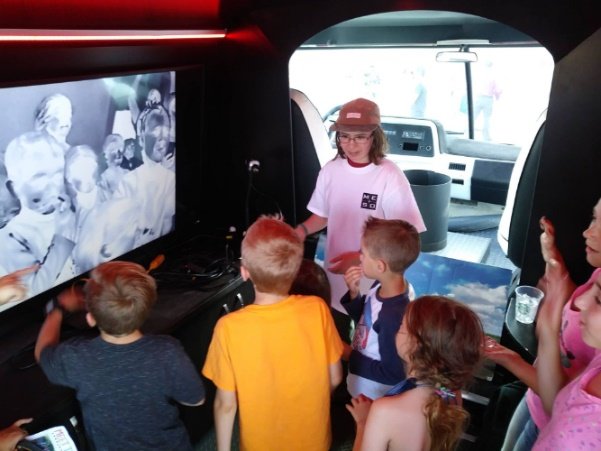 Students exploring exhibits inside MESO